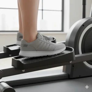 Detailed illustration of oversized non-slip foot pedals on a portable elliptical trainer for safety.