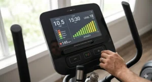 Close-up of a touchscreen console showing adjustable intensity levels for an electronic resistance elliptical.
