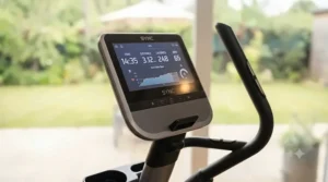 Close-up of the digital console on a silent smart elliptical machine showing workout metrics.