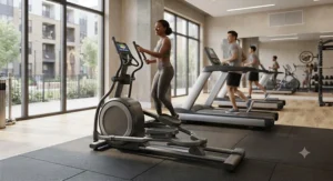 Diverse residents exercising together next to a premium low maintenance elliptical for apartment fitness center amenities.