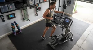 A durable heavy duty elliptical machine designed for intense cardio workouts in a private garage gym.