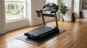 Protective 3x6 equipment mat for elliptical machine safeguarding hardwood floors from scuffs.