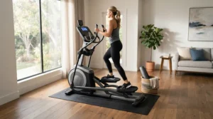 A hardwood floor protection mat for elliptical machine placed under a trainer in a modern apartment living room