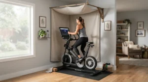 A sleek dust cover for elliptical machine indoors blending into a small urban apartment workout corner.