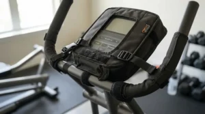 A universal elliptical cover for small apartment gym stretched securely over a standard cross-trainer.